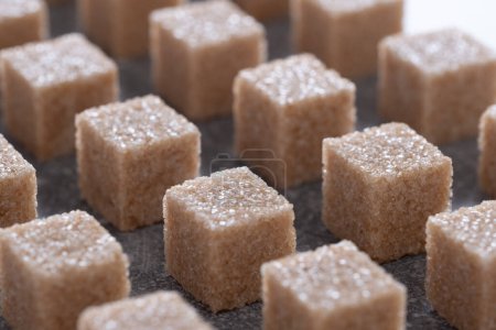 Straight rows of cane sugar cubes. Effect of dynamics.