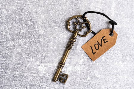 Old key with a tag with the word love