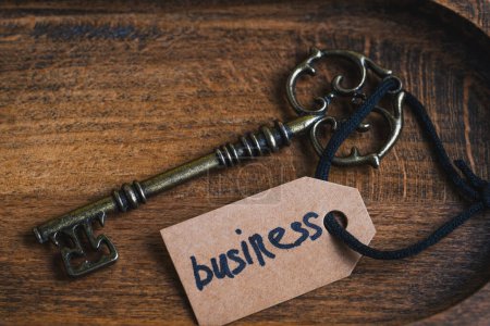 Key to success. Conceptual image of key and tag with word business