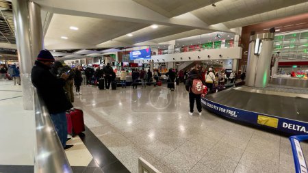 Photo for Atlanta, GA: December 23,2022- Passengers waiting at Hartsfield Jackson international airport in Atlanta after snow storm caused massive disruptions and delays in the flights across USA - Royalty Free Image
