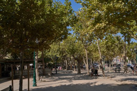 Photo for Saint-Tropez, France - August 8, 2022 - The scenic Place des Lices - the square is both home to a Provencal market and a playground for bowls players - Royalty Free Image