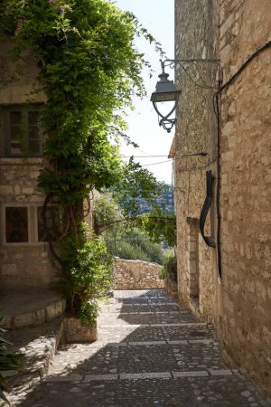 Photo for Saint-Paul de Vence, France  August 11, 2023 - traditional old stone houses on a street in the medieval town of Saint Paul de Vence - Royalty Free Image