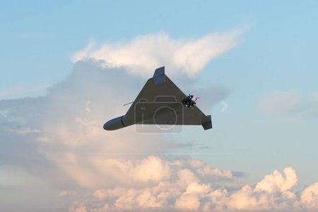 Photo for Russian army kamikaze combat drone in the sky against clouds, war in Ukraine, drone attack, 3d render. - Royalty Free Image