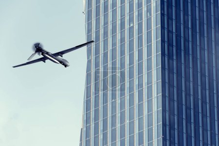 Combat military drone flies into multi-story skyscraper, UAV attacks Russian houses, war in Ukraine and Russia,