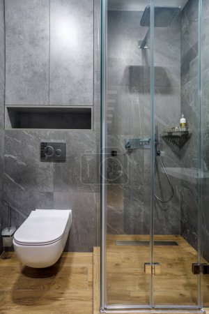 Photo for Modern furnished bathroom dark grey interior design with granite grey tiles - Royalty Free Image