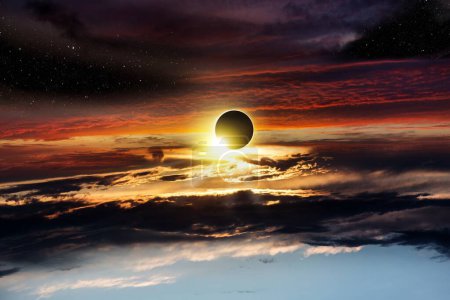 Photo for Total solar eclipse in clouds, atmosphere . eclipse of the sun, beautiful phenomenon of nature - Royalty Free Image