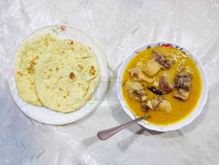 Photo for Beef Rezala "Rezala", is made with a white-colored rich meat preparation where yogurt, malai, nut paste, and other ingredients. - Royalty Free Image