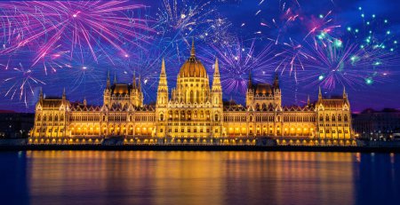 Photo for Fireworks display over parliament New Year celebrations in Budapest. Night view of the Parliament in the city of Budapest in Hungary - Royalty Free Image