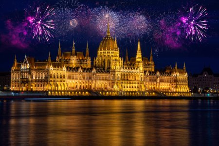 Photo for Fireworks display over parliament New Year celebrations in Budapest. Night view of the Parliament in the city of Budapest in Hungary - Royalty Free Image