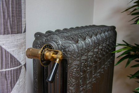 Photo for Cast iron radiator close-up. Vintage radiator. - Royalty Free Image