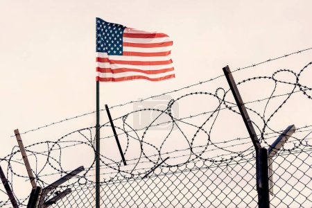 Photo for Concept of United States of America closed borders with flag and wire fence. USA immigration and homeland security. American dream concept, not accessible and hard to reach. mexican border - Royalty Free Image