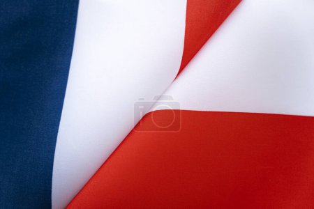 Flags France and Poland. The concept of international relations between countries. The state of governments. Friendship of peoples.