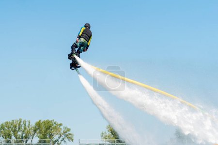 Photo for Fly board show at the port. Extreme sport - Royalty Free Image