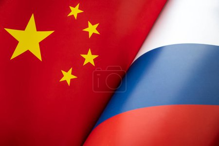 Flags of the china and Russia. The concept of international relations between countries. Sanctions against Russia. The state of governments. Friendship of peoples.