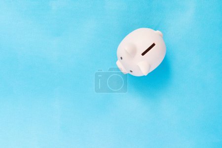 Photo for Blue piggy bank money box blue studio background. top view - Royalty Free Image