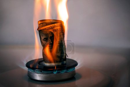 Photo for Increase in the price of gas. The concept of problems in the USA economy. The dollar is burning on a gas stove. The sale of gas. Expensive gas supply. dollar crisis. Rejection of the dollar. - Royalty Free Image