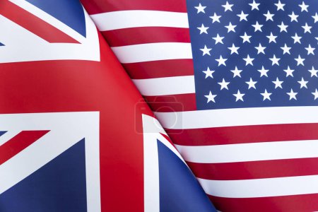 Photo for Background of the flags of the USA and Great Britain. The concept of interaction or counteraction between the two countries. International relations. political negotiations. Sports competition. - Royalty Free Image