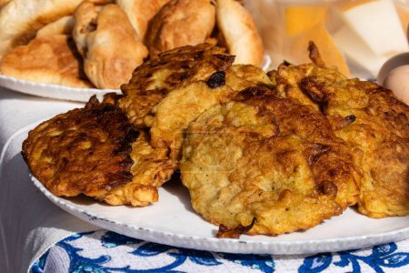 fried pancakes or pancakes. on a plate on the table. Traditional cuisine of Russia or Belarus.