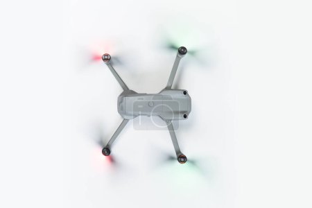 Photo for Aerial Drone Isolated on White Background. Top View of Quad Copter with Digital Camera. Flying Drone. - Royalty Free Image