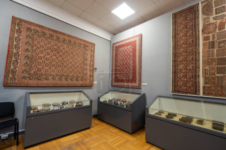 Photo for Clothes, skullcaps, carpets, handmade items in museum. State Museum of Applied Arts of Uzbekistan. October 28th. 2023 Tashkent, Uzbekistan. - Royalty Free Image
