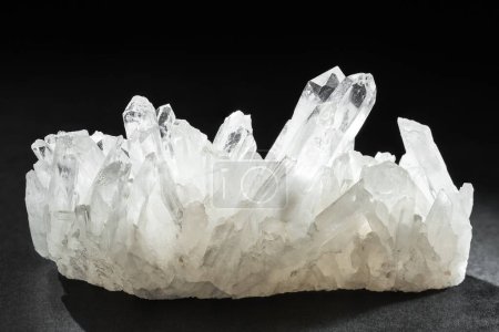 Photo for Pure Quartz Crystal Cluster on Black Background. Natural growing crystals of Clear Quartz - Royalty Free Image