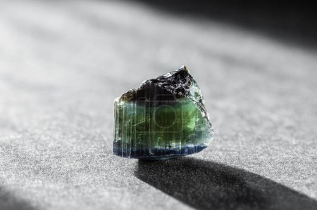 Photo for Raw Blue and Green Tourmaline Crystal on Dark Background in Studio Light - Royalty Free Image