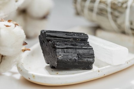 Natural Uncut Black Tourmaline Crystal on the White Ceramic Tray