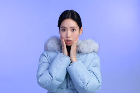 beautiful young Korean Asian woman portrait studio photo in winter skin beauty and cosmetics concept, weared padded