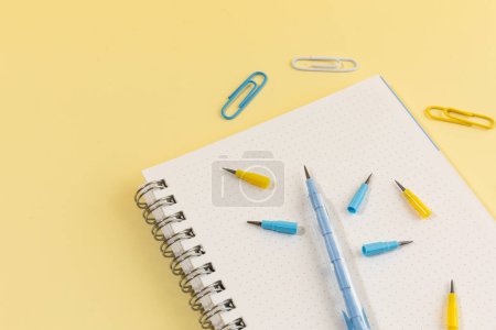 school supplies and diary concept, note and cartridge pencil