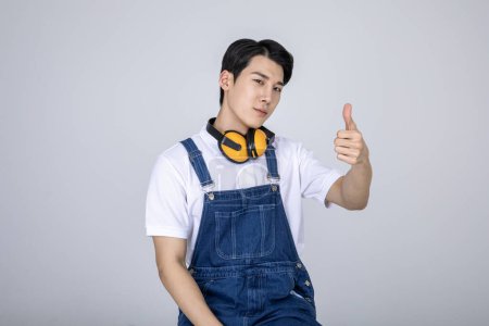 millennials and gen z, korean asian young man carpenter with hand motion