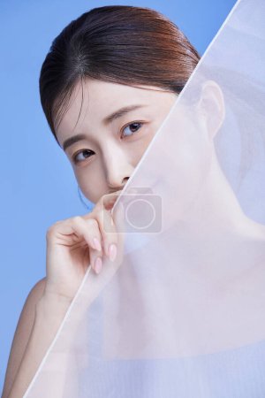 beauty concept photo of korean asain beautiful woman with chiffon, studio background