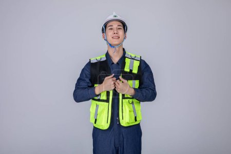 millennials and gen z, korean asian young man, site staff wearing a safety vest, studio background