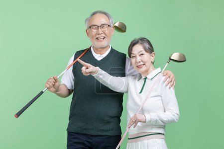 A senior holding a golf club