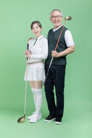 A senior holding a golf club