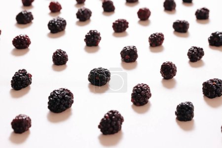 oblique arrangement of raspberries on white background 