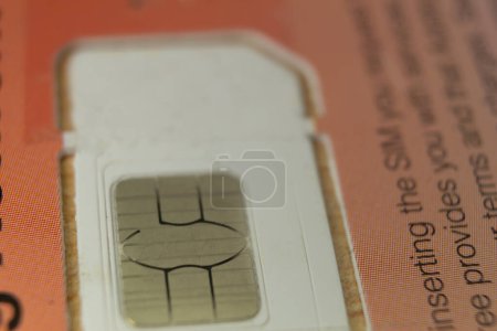 Photo for Macro view of a cell phone chip in its unused blister pack - Royalty Free Image