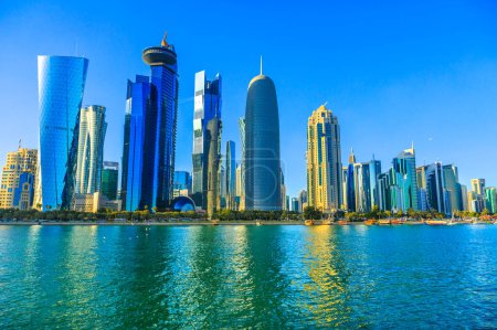 Photo for Doha, Qatar - February 20, 2019: Qatar International Exhibition Center, Doha Tower, Salam Tower, World Trade Center and Doha Bank Tower, iconic skyscrapers in Diplomatic District, West Bay skyline. - Royalty Free Image