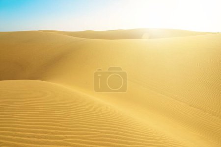 Photo for The Maspalomas Dunes in Gran Canaria, Spain is a stunning sunset desert landscape made of sand. Its a must-visit spot for anyone traveling to the island. - Royalty Free Image