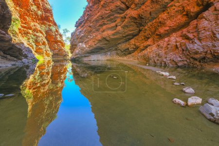 Photo for Permanent waterhole of Simpsons Gap reflects the red cliffs in West MacDonnell Ranges, Northern Territory, Central Australia. - Royalty Free Image