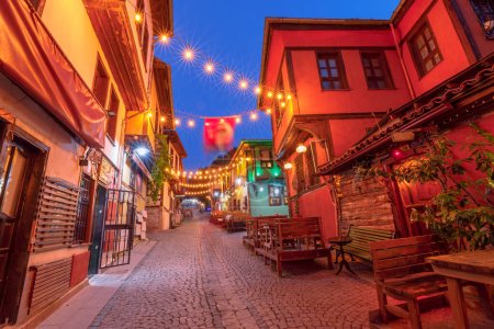 Photo for Night view of Eskisehir city unveils its diverse neighborhoods, connected by crisscrossing streets. Architectural wonders of historic Odunpazari district enhance the distinct urban landscape of Turkey - Royalty Free Image