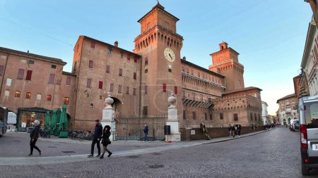 Photo for Ferrara, Italy - Dec 3, 2023: Ferrara Castle, known as Castello Estense, is a medieval fortress in the center of Ferrara, constructed in 1385. Encircled by moat, and four towers with a clock tower. - Royalty Free Image