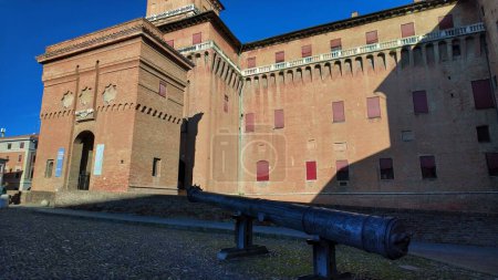 Photo for Ferrara Castle, known as Castello Estense, a medieval fortress in Ferrara center, Italy, constructed in 1385. Encircled by moat, Ferrara castle comprises sizable central block with four corner towers. - Royalty Free Image