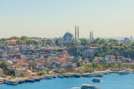 Galata Tower aerial view on Istanbul skyline with Suleymaniye Mosque. Galata Tower is a iconic landmark that offers breathtaking panoramic views of Istanbul city and Bosphorus Strait of Turkey