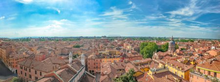 Stunning aerial panorama of Modenas historic downtown, captured from the iconic Ghirlandina bell tower overlooking the vibrant Piazza Duomo square