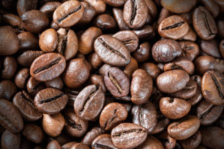 Close-up of roasted coffee beans, background, texture. Good mood. Coffee aroma.High quality photo