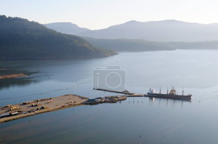 Freighter at the Western Forest Products terminal, Cowichan Bay, Vancouver Island, British Columbia, Canada.