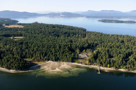 Aerial photo of an estuary at the northern end of Saltspring Island. Osborne Bay and the Crofton Paper Mill are in the background on Vancouver Island, Saltspring Island, British Columbia, Canada