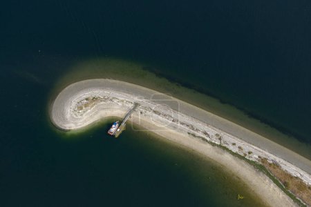 Aerial photograph of Ganges Spit with a small dock and boat, Saltspring Island, British Columbia, Canada