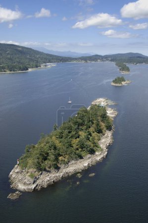Aerial photograph of the Chain Islands in the entrance to Ganges Harbour with the town of Ganges in the background, Saltspring Island, British Columbia, Canada