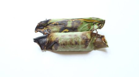 Photo for Traditional food of thailand made from sticky rice wrapped in banana leaves with taro and banana filling and Grilled on charcoal turtle isolate on a white background - Royalty Free Image
